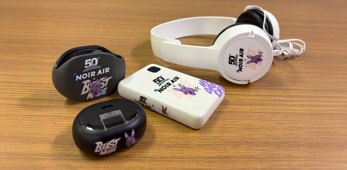 Custom UV-DTF printed headphones, earbuds, and power bank- branded event merchandise example